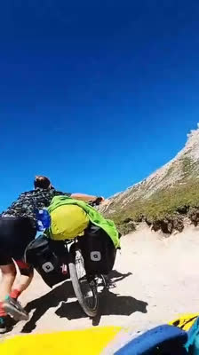 Damien Largeron, Tristan and Louna Ladevant arrive by bike at the foot of the Tre Cime di Lavaredo · Priceless Climb