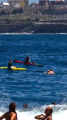 Damien Rider celebrates the completion of his 800-kilometre paddleboard challenge to Bondi Beach · Heart of the Sea